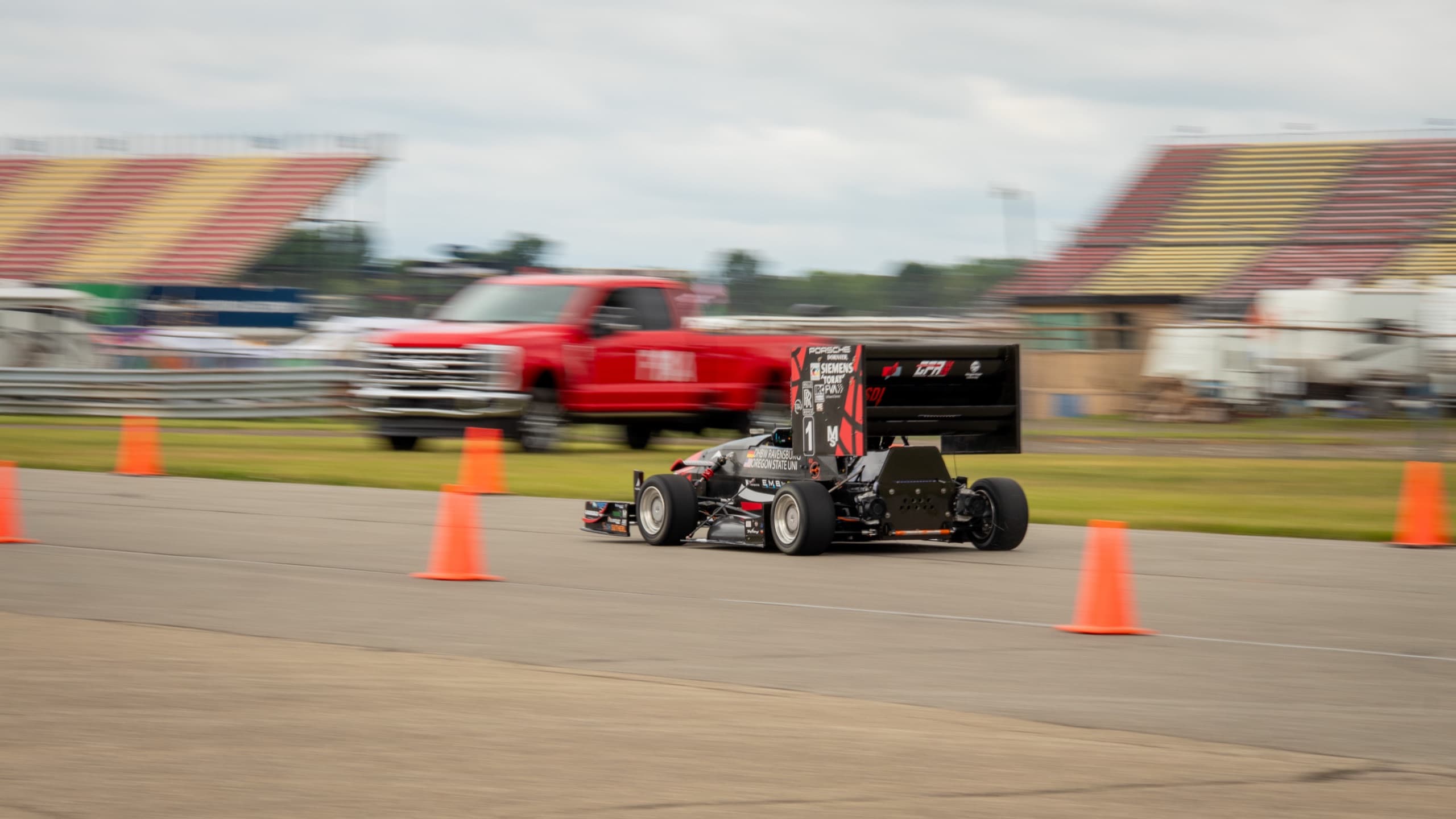 The Global Formula Racing car on course during autocross at Formula SAE Michigan, panned at speed.